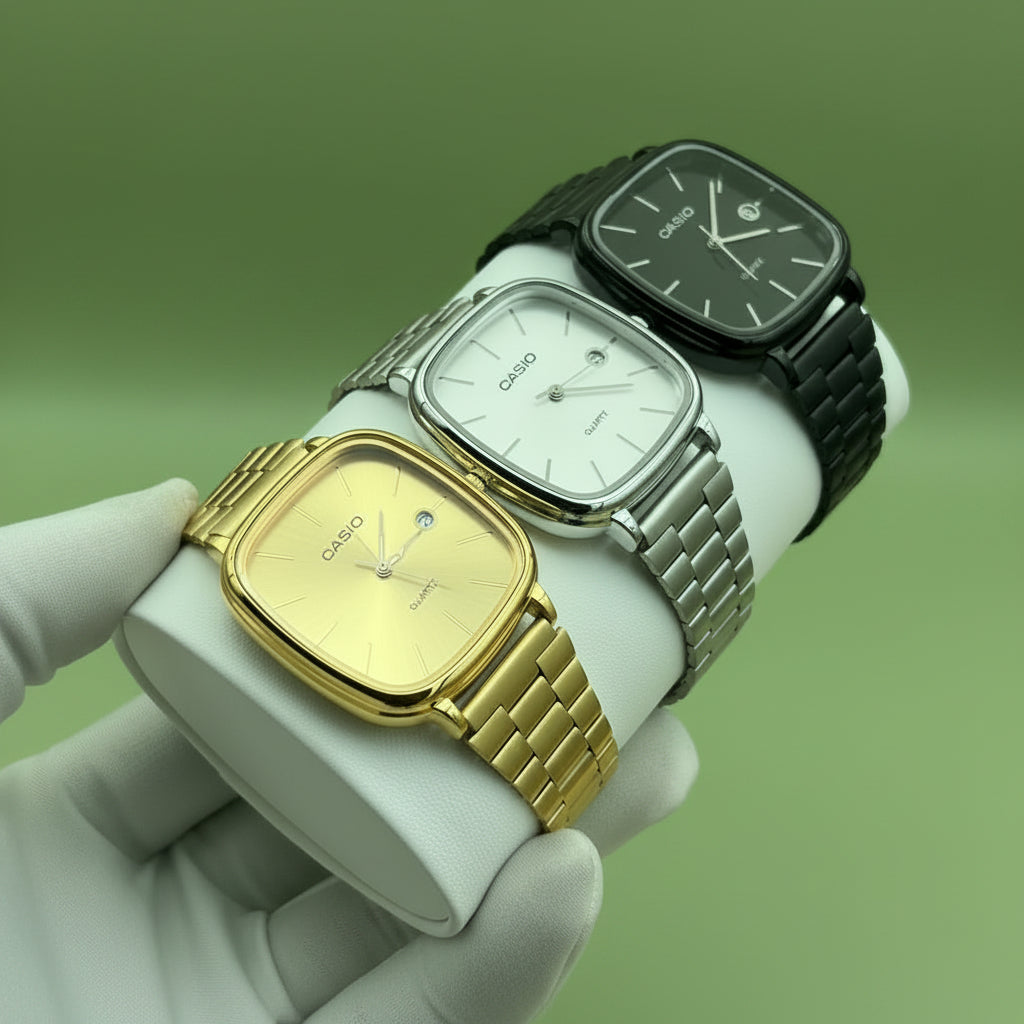 Three Casio watches on a table with a visible Casio box in the background.